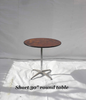 Short, thirty inch diameter round wooden table